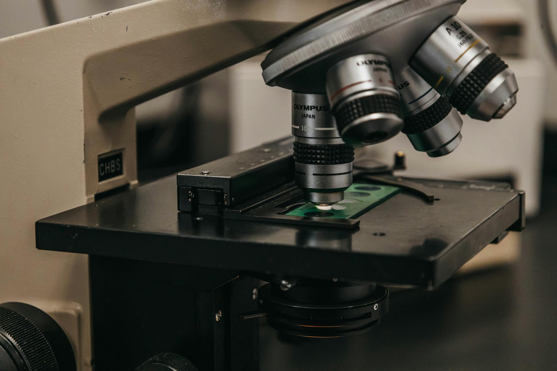 Detailed view of a laboratory microscope, essential for scientific research and analysis.