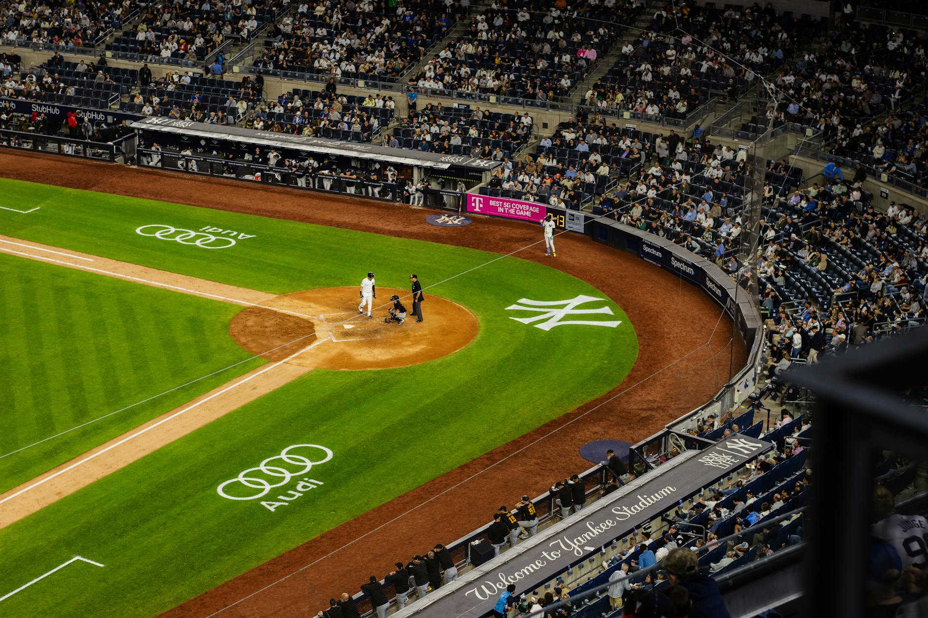 Aerial view of a baseball game at Yankee Stadium with a packed crowd.
